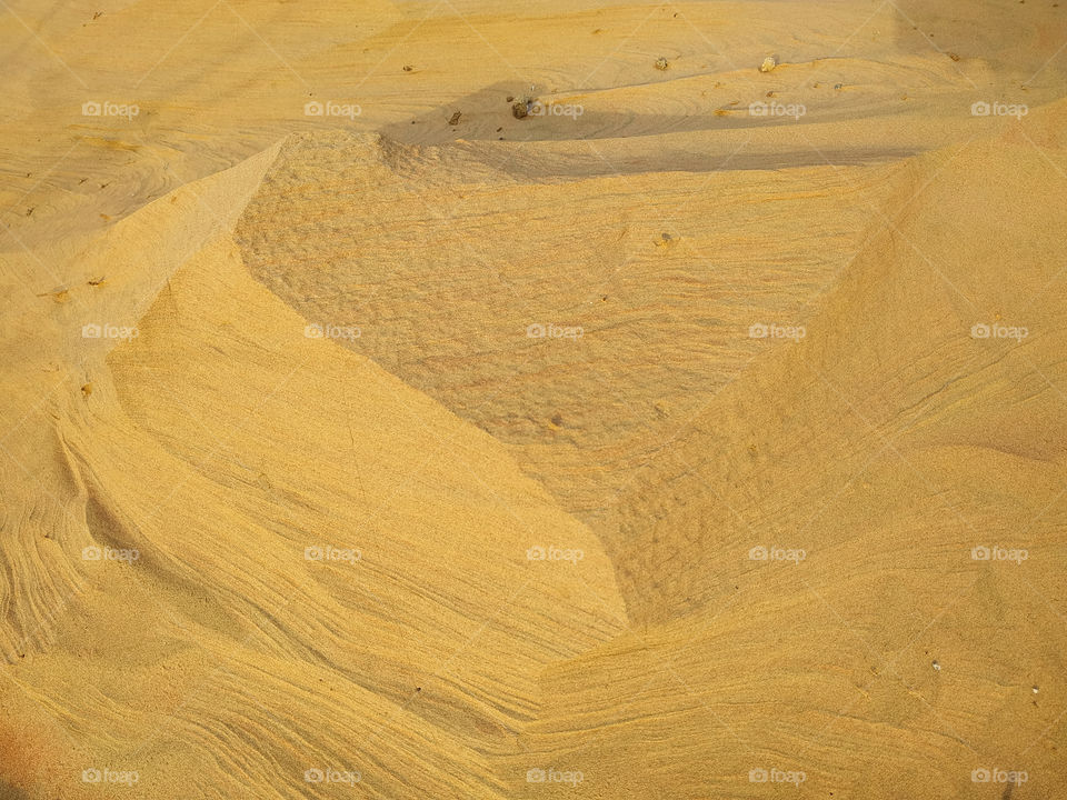 A closeup of sand dune texture