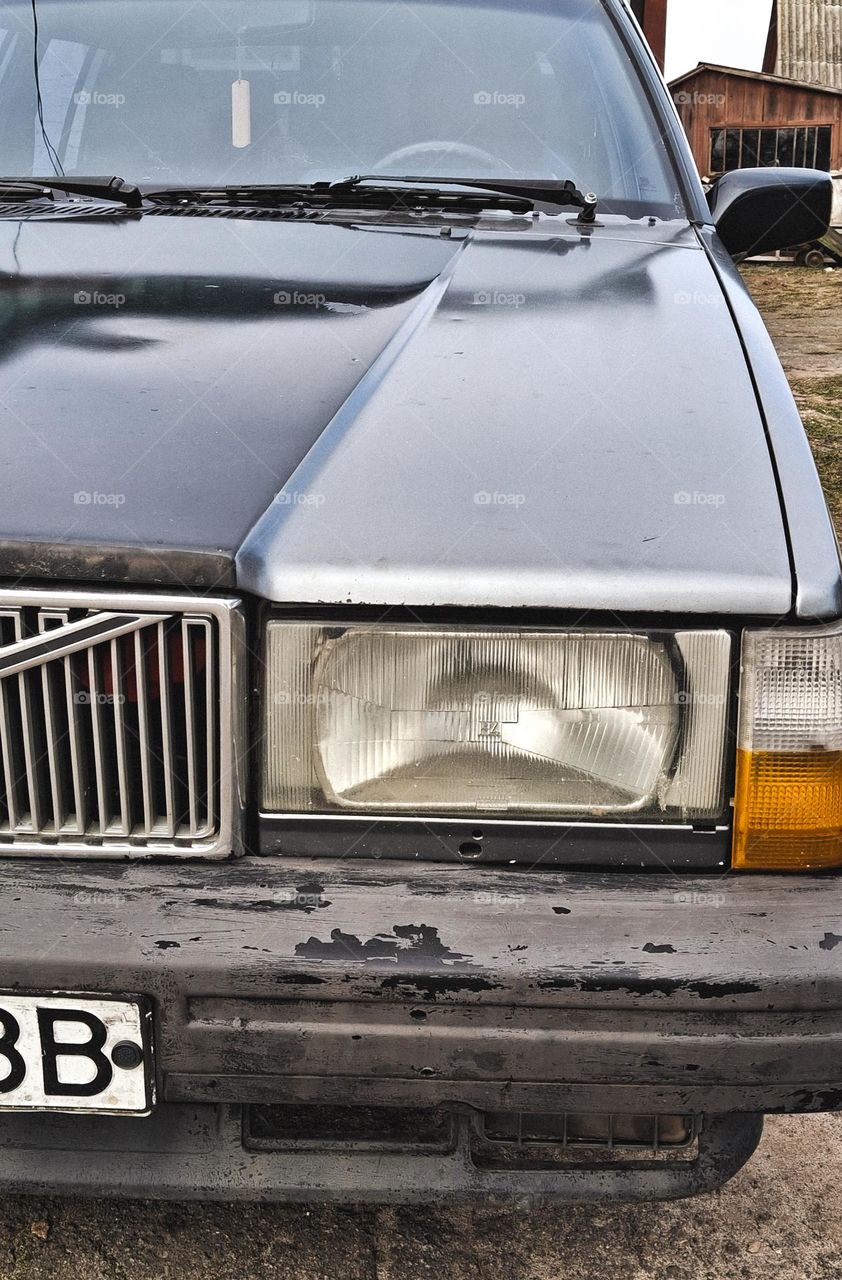 The headlights and hood of a 1986 Volvo truck that is still running