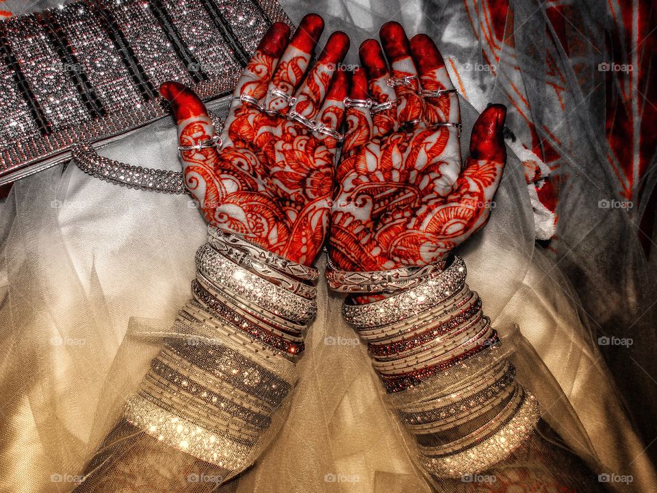 beautiful indian bride with Mehendi in hands