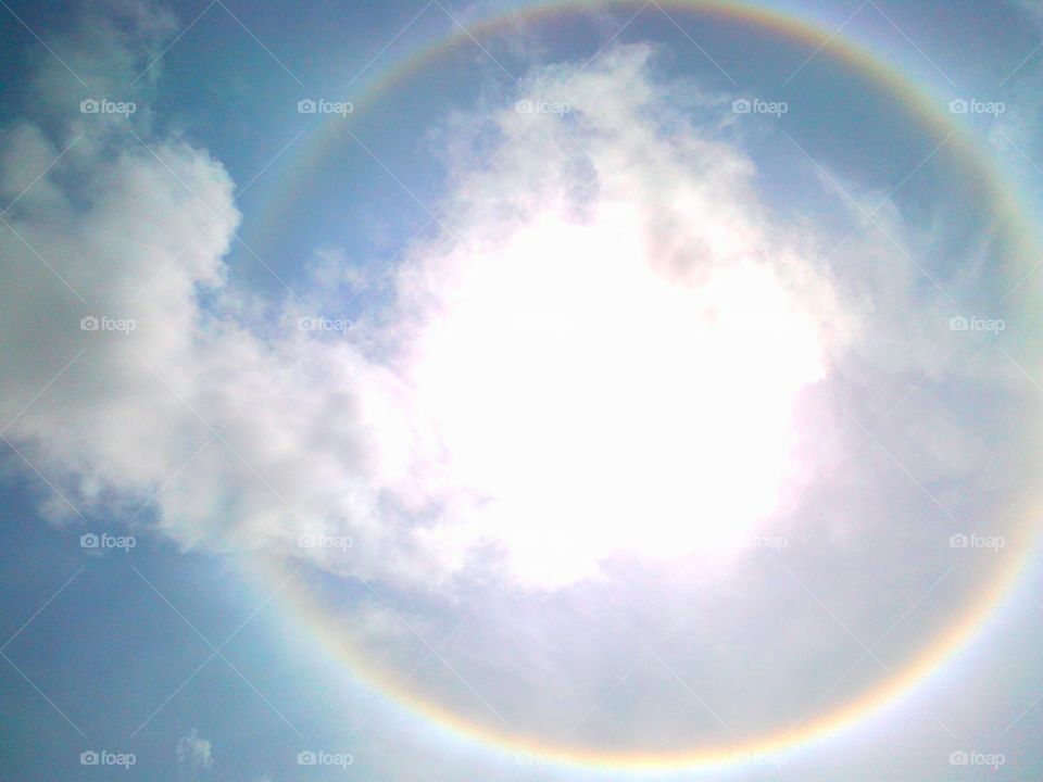 Clouds over sun halo