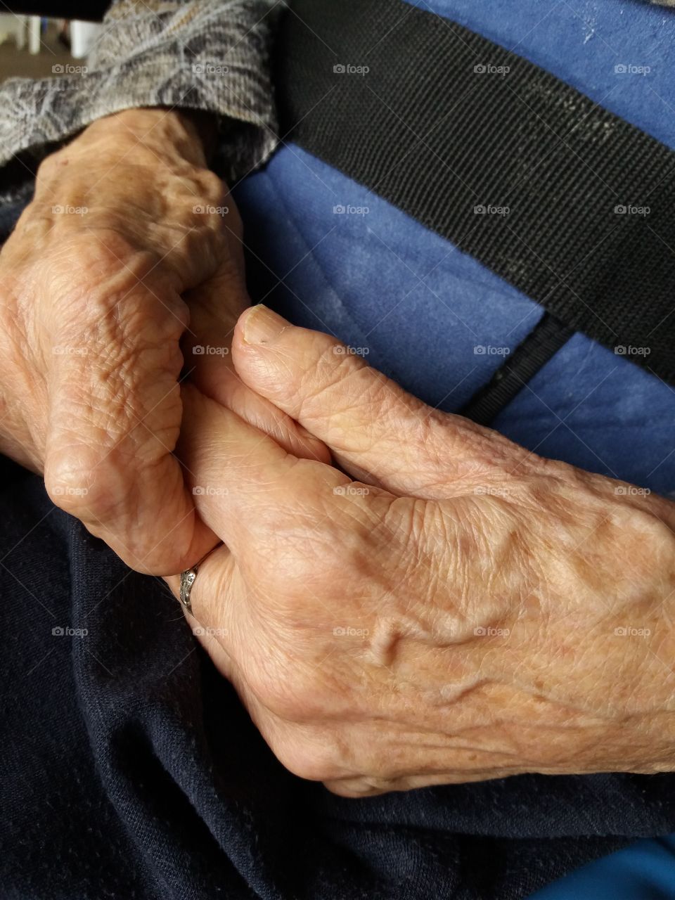 Close-up of old person holding hand
