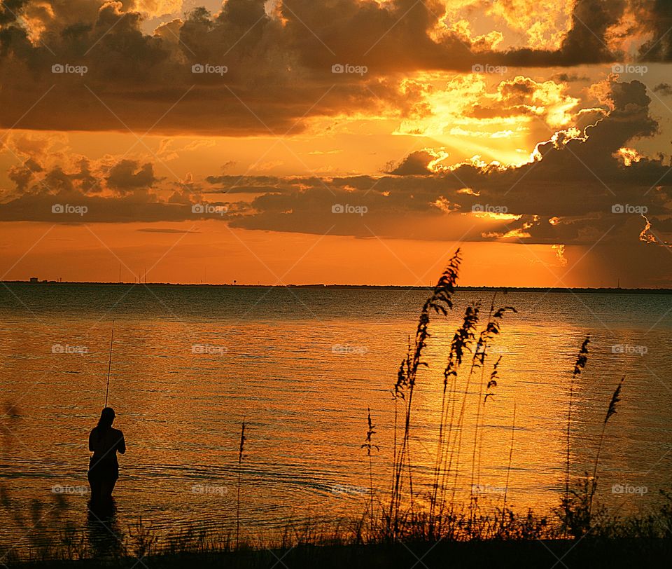 Fishing in a magnificent sunset