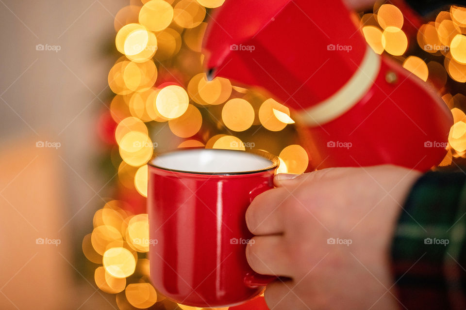 cup of coffee in a cozy festive Christmas atmosphere