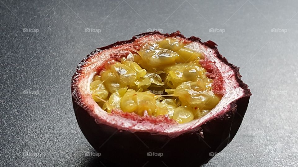 A passion fruit cut in half