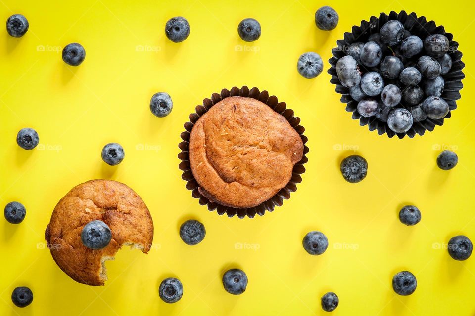 Tasty snacks on a yellow background