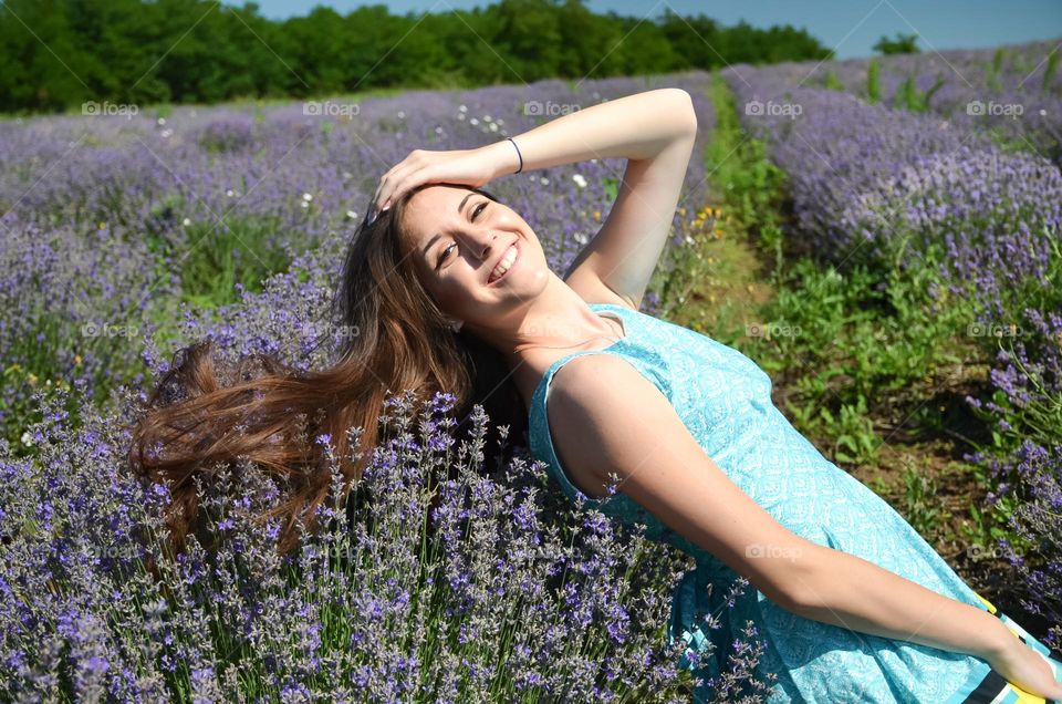 Portrait of Smiling Young Girl on  Lavender background