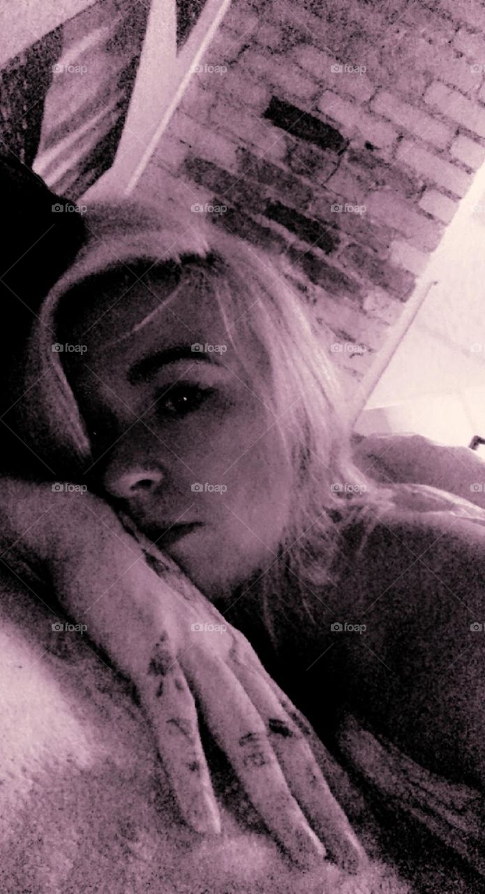 Black and white photo laying in bed in all the feelings 