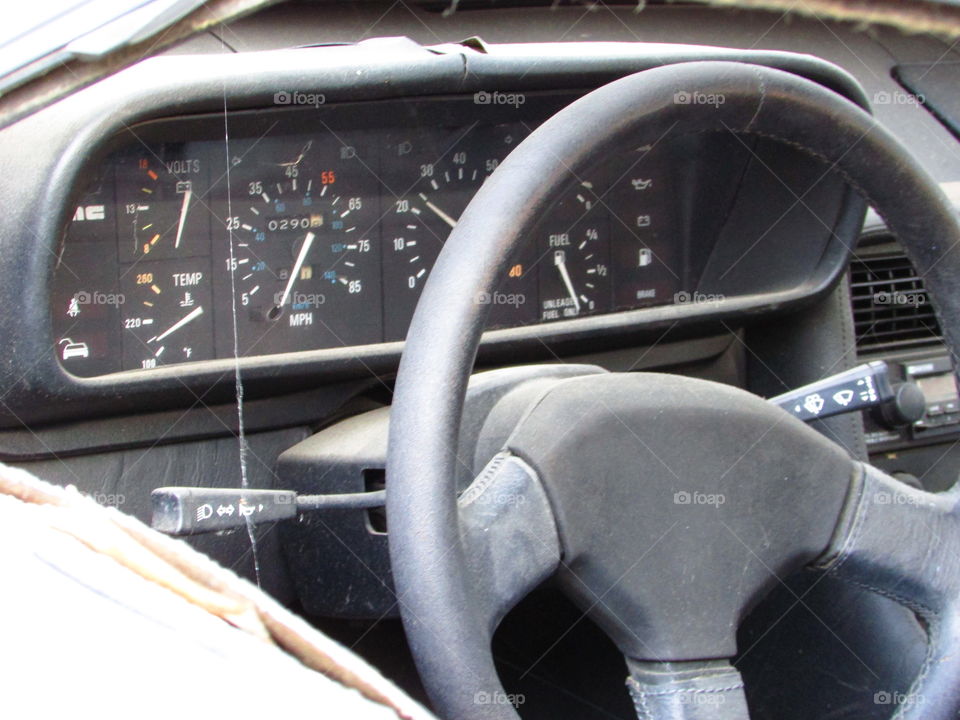 weather beaten dashboard of a out of commission DeLorean