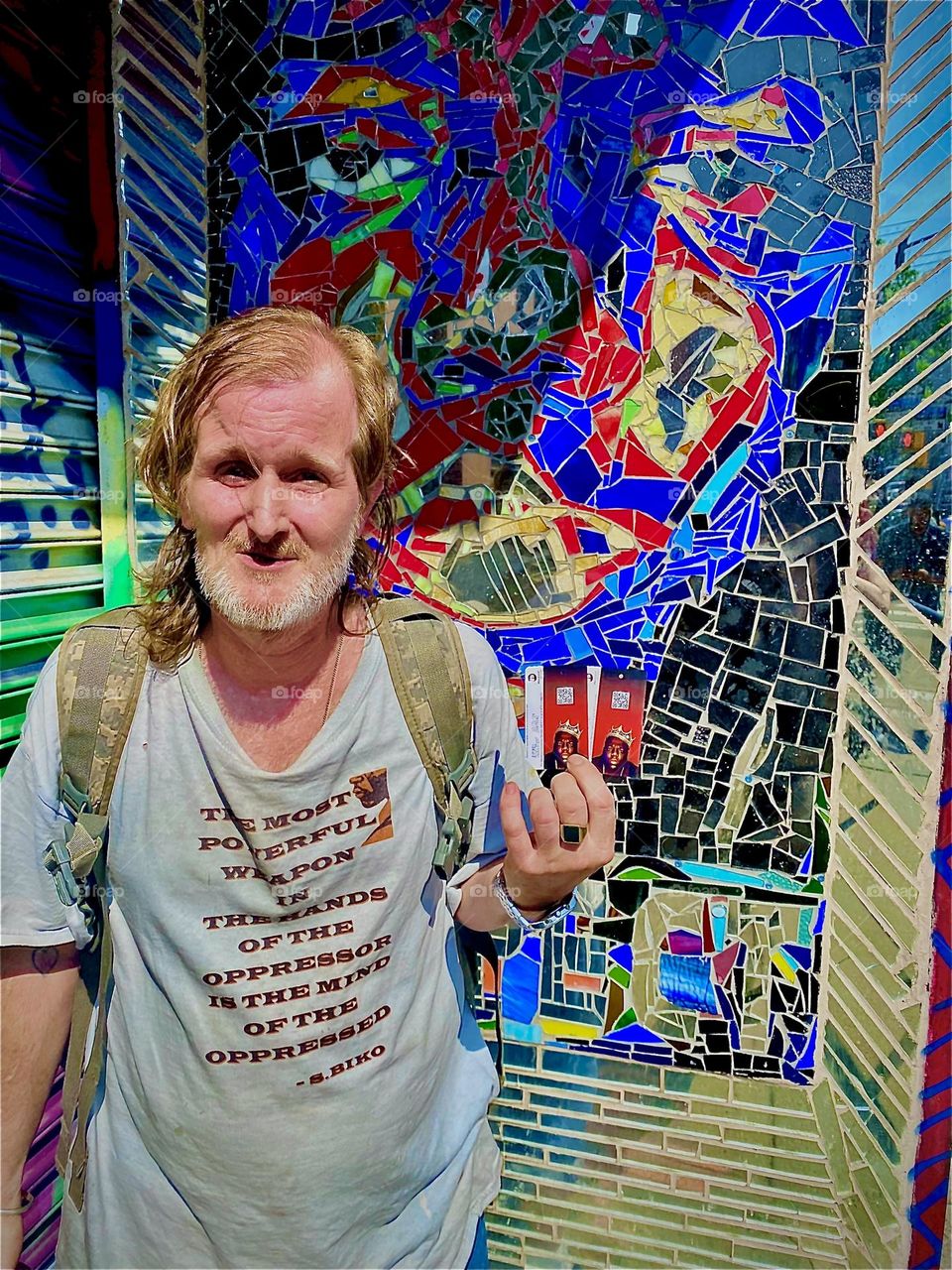 SUCCESS !!! My partner Timothy holds up his purchase of two commemorative metro cards w the likeness of “Christopher Wallace” a.k.a. “Notorious B.I.G.” imprinted on them, the famous photograph of him wearing a crown. 2022. Hypnotic Productions