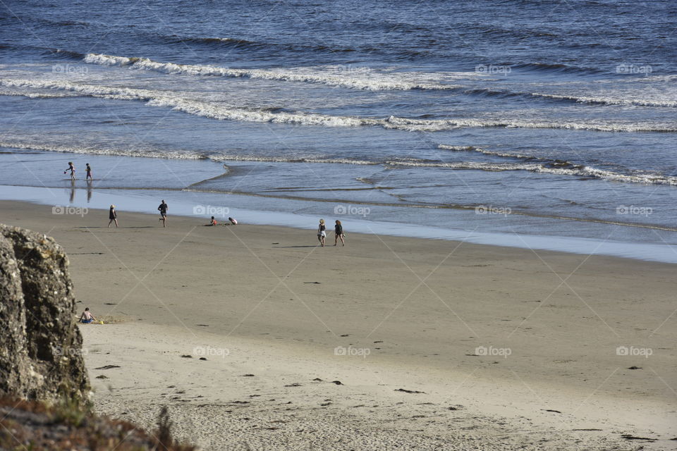 People strolling on beach