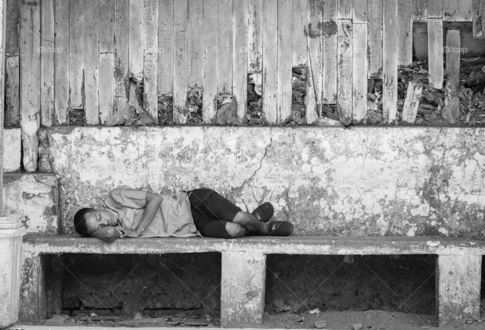 Rangoon/Myanmar-April 14 2019:Man’s sleeping at plate form of train station