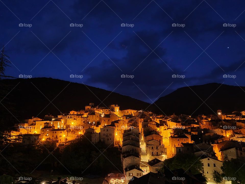 beautiful italian village lit up at night