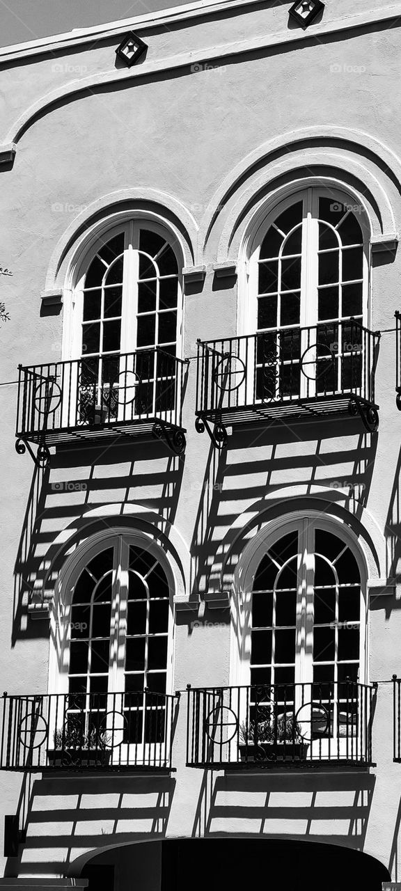 French style building in the marina district of San Francisco beautiful light and shadows on this classic style with its arched windows 