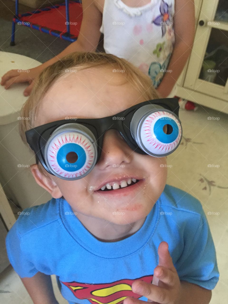 Close-up of a boy wearing funny eyeglasses