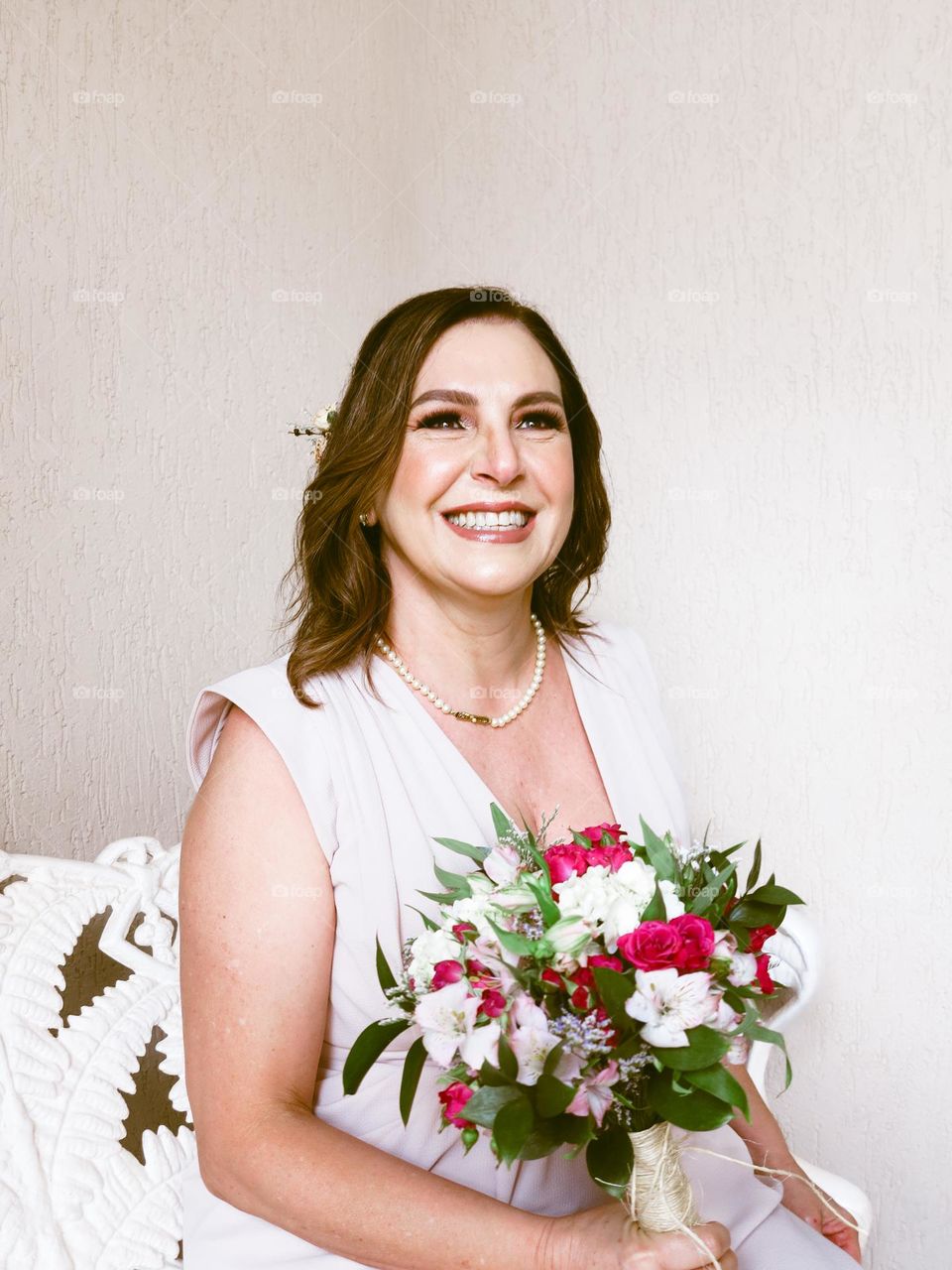 Beautiful 60 year old Brazilian bride with a flower bouquet