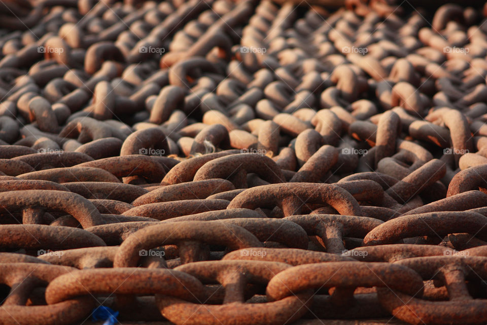 heavy chains lying on a ship