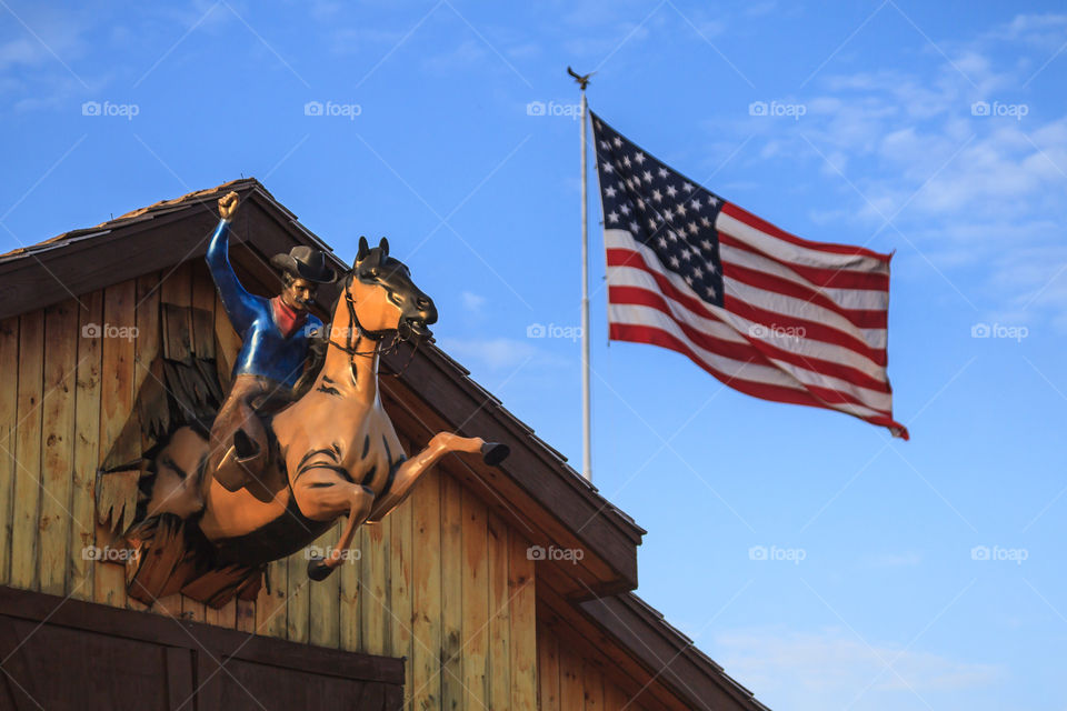 Cowboy, horse and the American flag