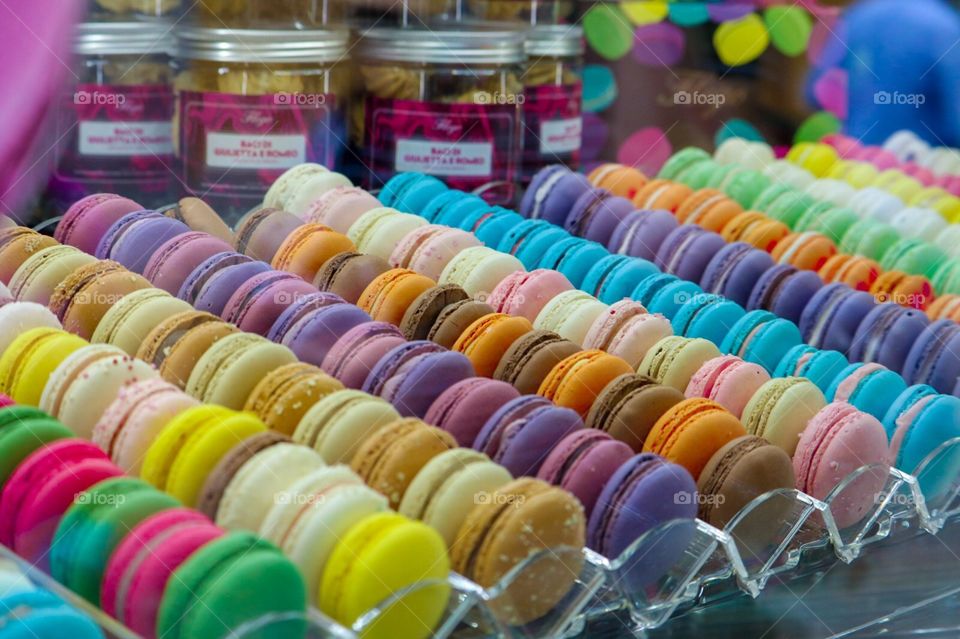 colorful and deliciously beautiful macaroons in a charming coffee shop window