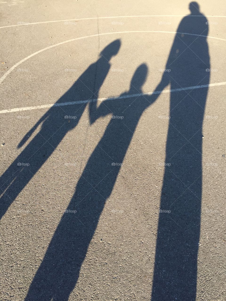 Shadow of people standing together