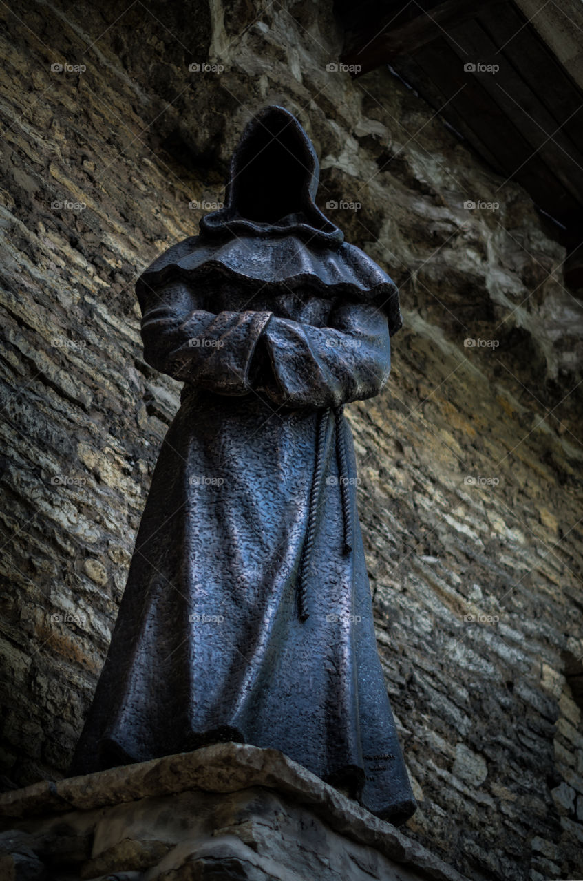 A statue of a friar from medieval times.