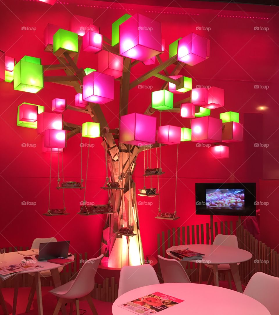 A working space at the cafeteria under the colorfull tree lamp with the swings