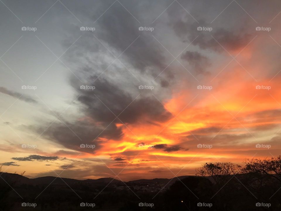 Cloudy sunset in the winter in the southeast of Brazil where colors from yellow to dark gray can be seen 