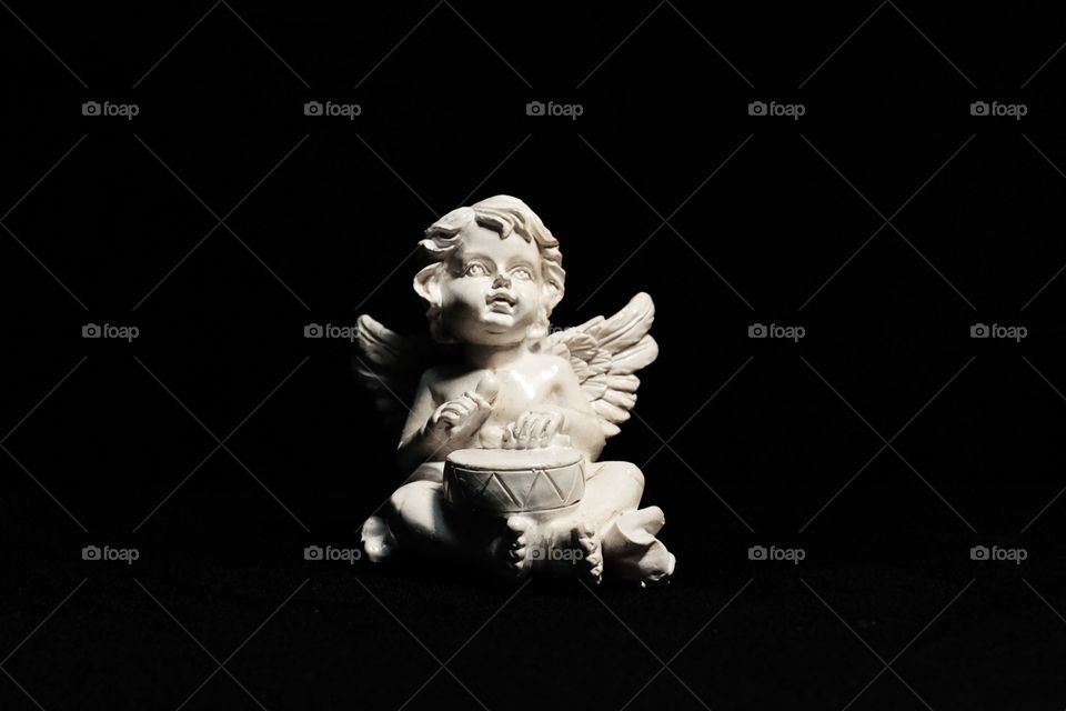 Cupid on black background