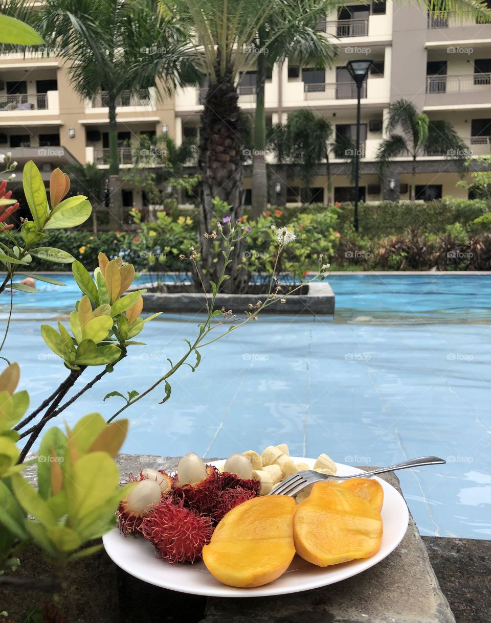 Tropical fruit plate by the pool