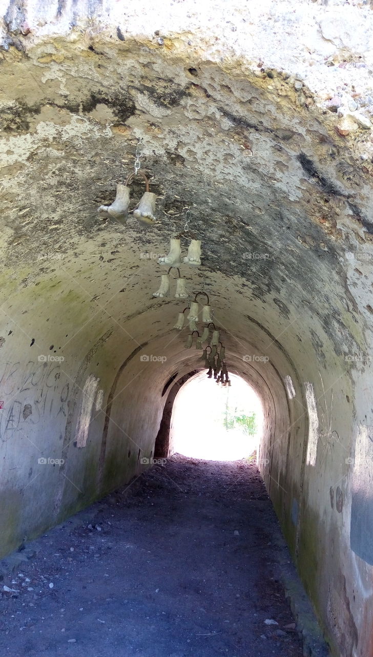 Hanging feets in the tunnel