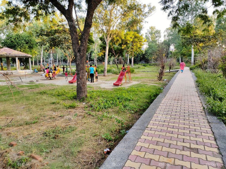 Far away view of Children playing in the park