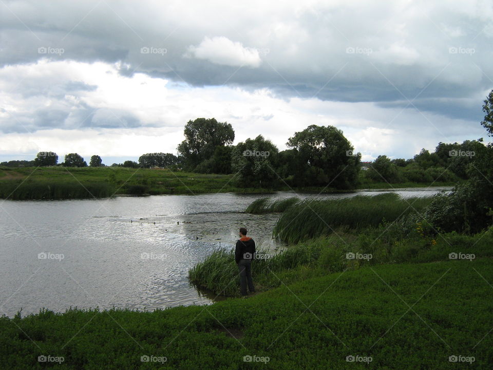Man staring at the lake