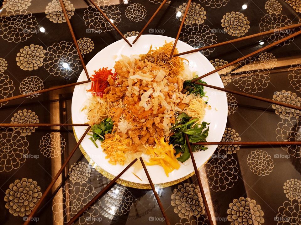 Yusheng, (Chinese: 鱼生), or Prosperity Toss, also known as lo sahng (Cantonese for 撈生) is a Cantonese-style raw fish salad.