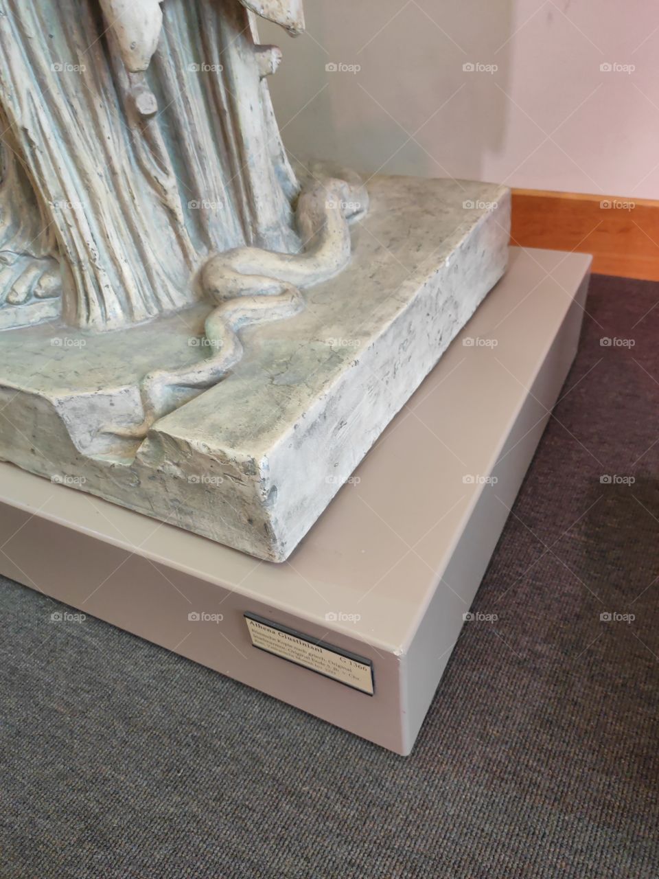 Snake carved on stone monument