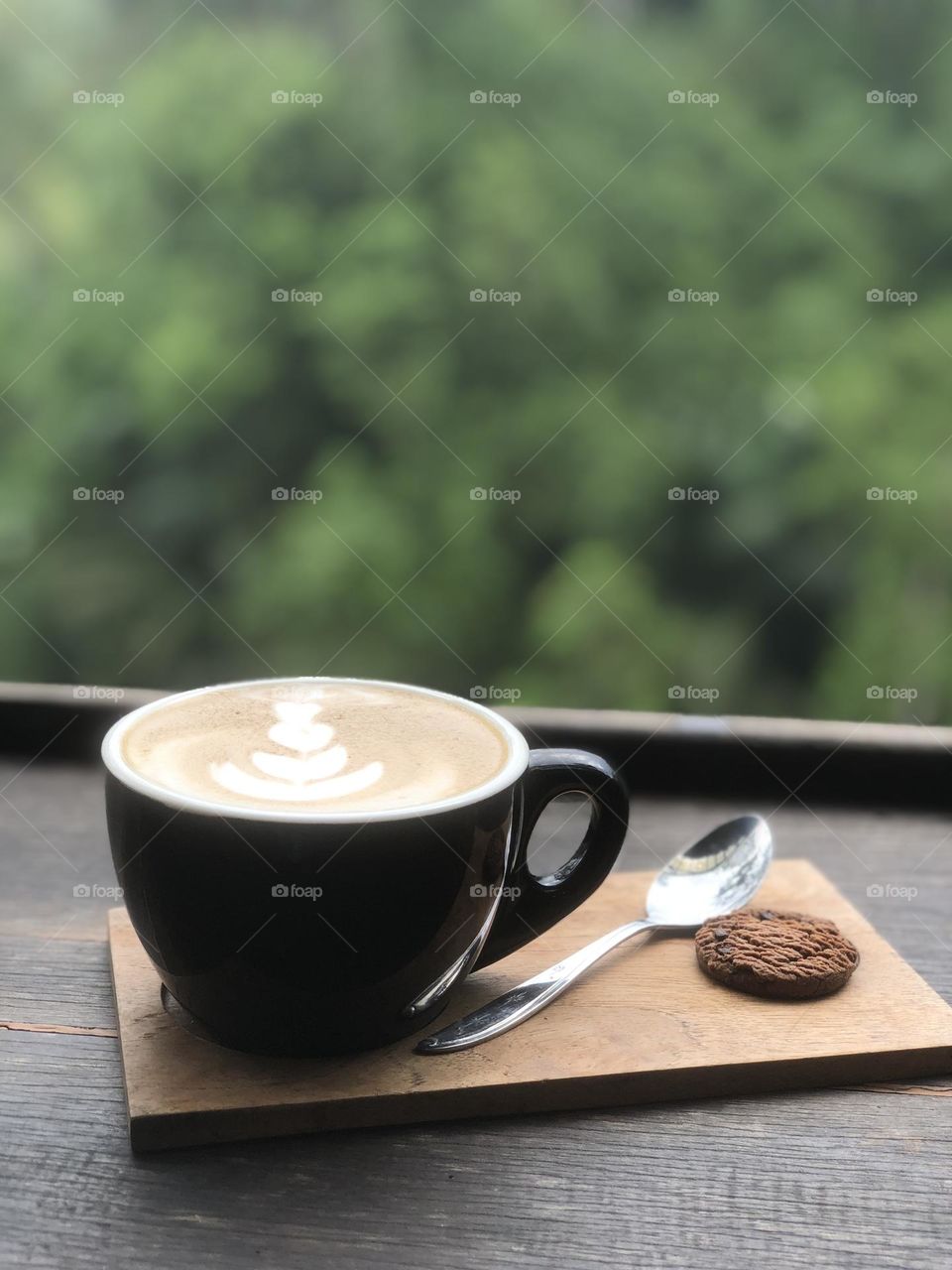 A cup caffee latte with georgeous view