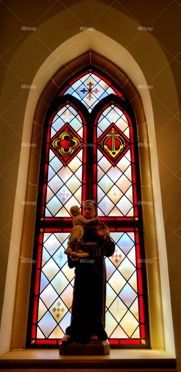 Church Stain Glass Window and Statue