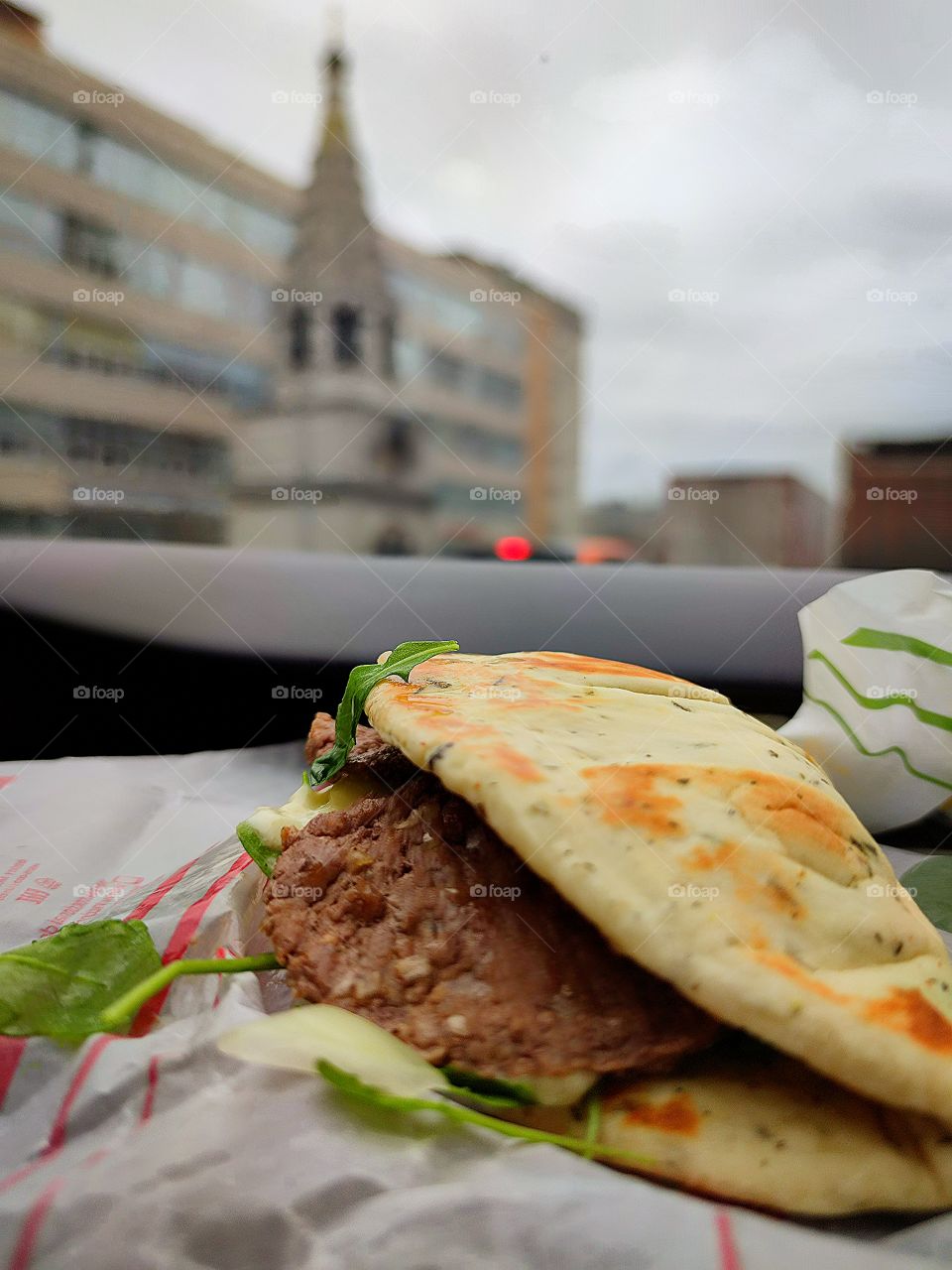 Burger "Panini Toscana" on the torpedo of the car