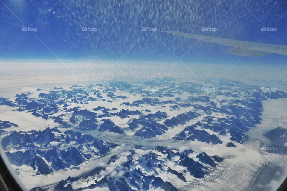 Greenland view from the window of an airplane