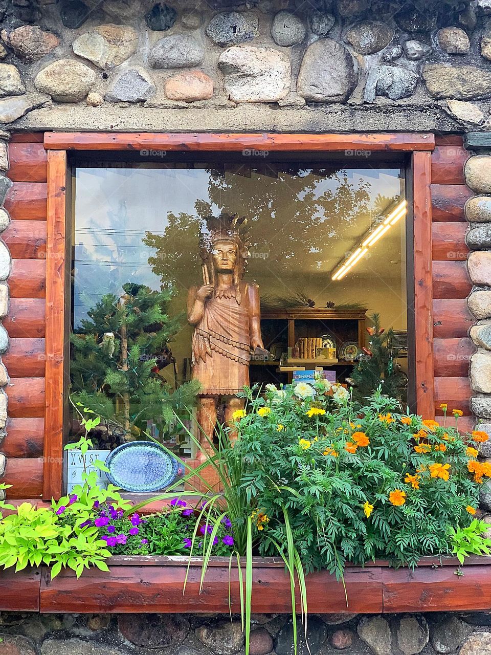 Wooden figure - Red Indian.  Gift shop showcase.