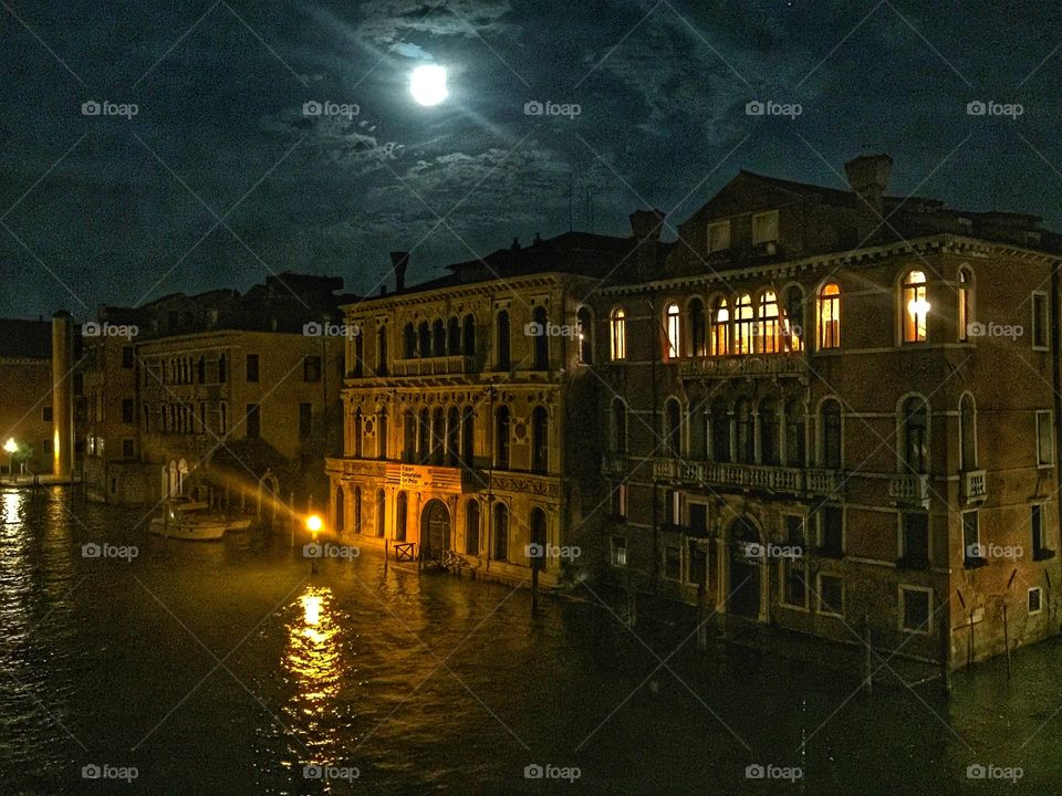 Night in Venice - the old buildings and the canal are magically illuminated by the moon