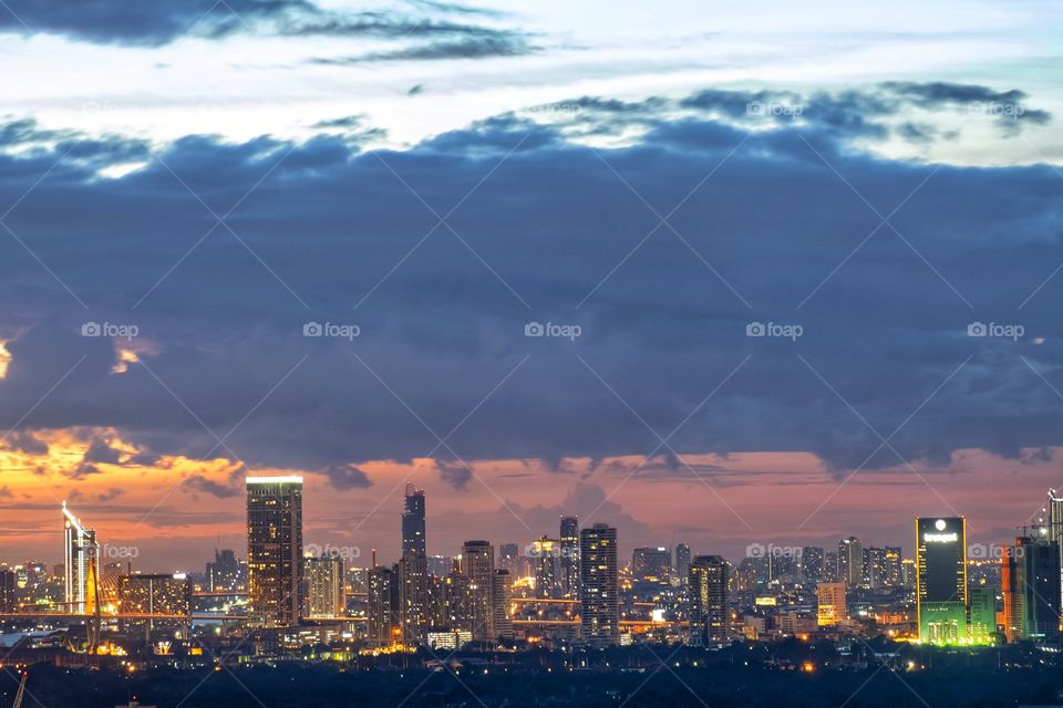 Beautiful of skyscraper in twilight and fog after rain