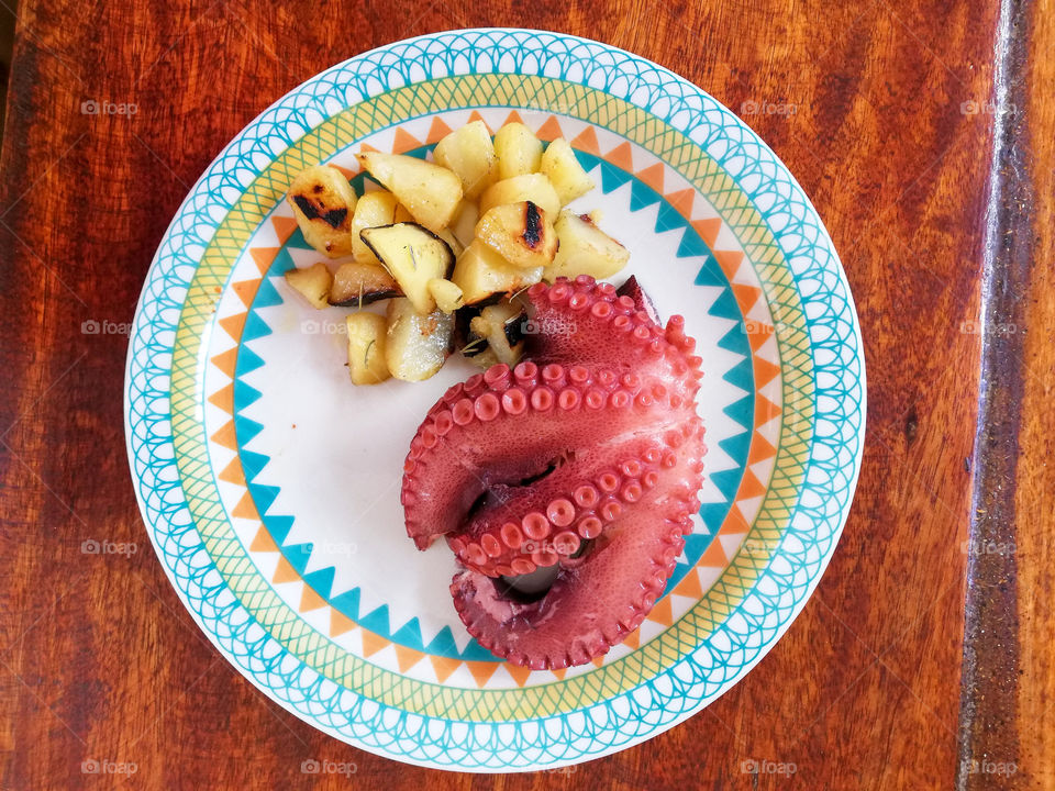 Octopus boiled with potatoes. Brazil 
