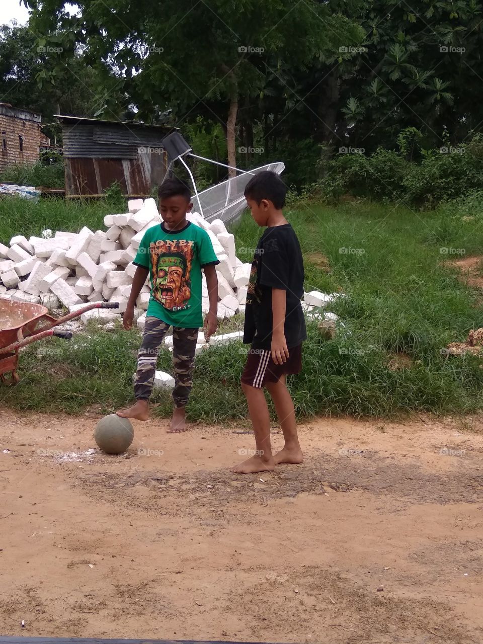 The village boy is happy to play happily