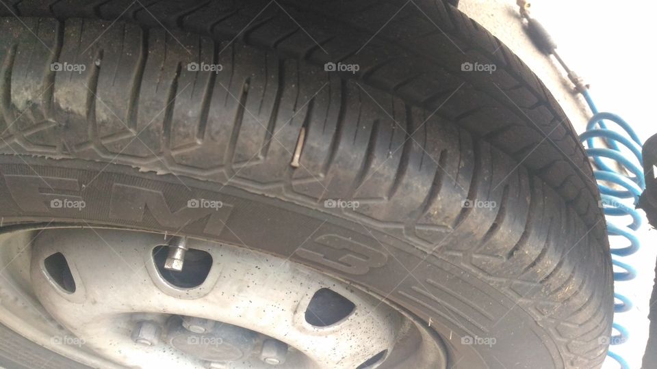 Car Tyre with big nail