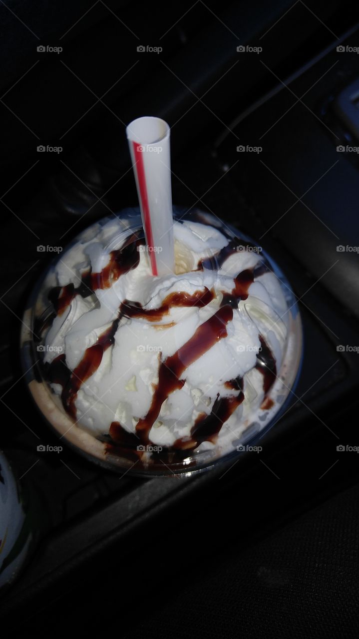 mocha frappe from McDonald's topped with whipped cream and chocolate drizzle