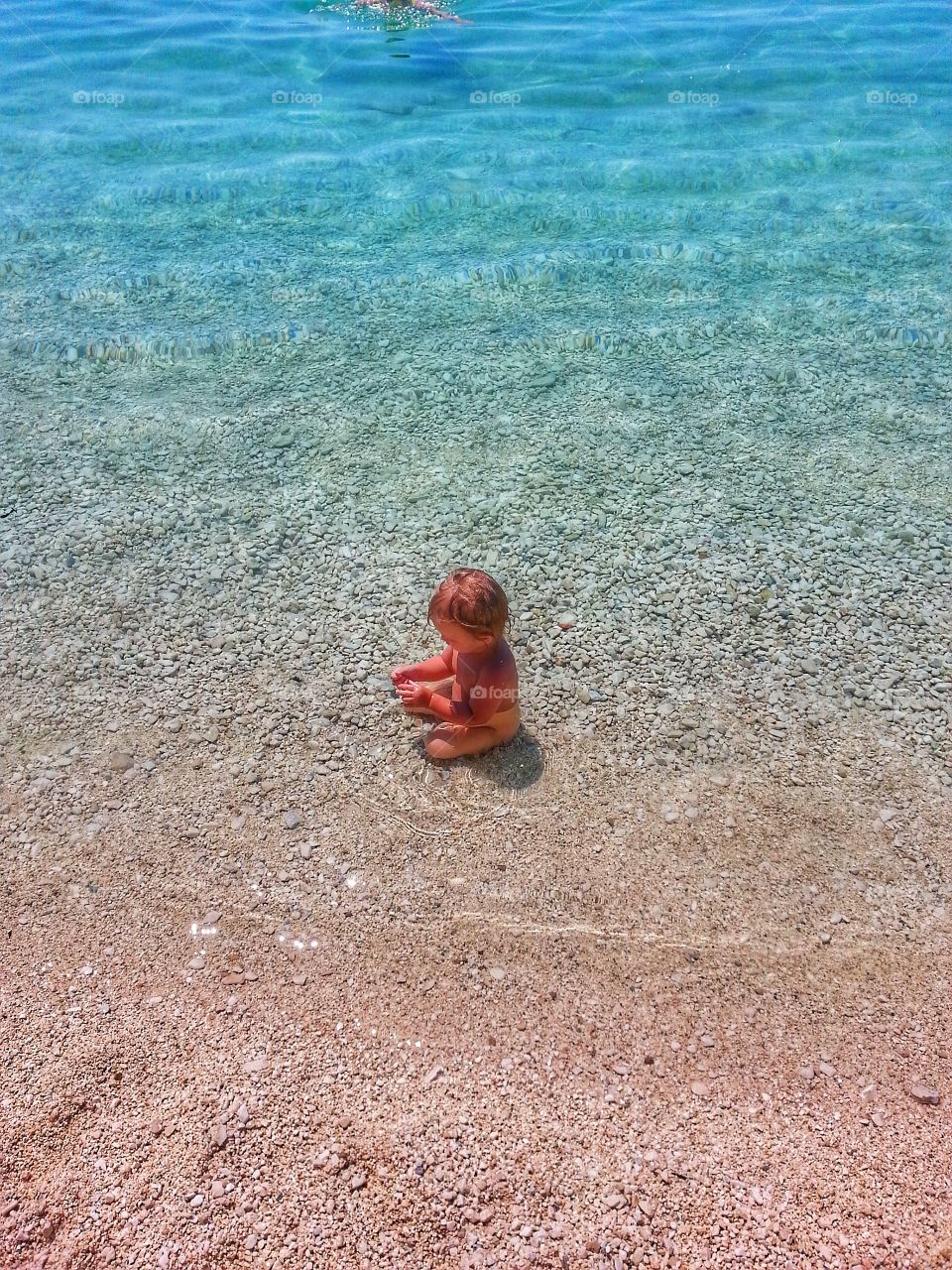 Baby enjoying sea