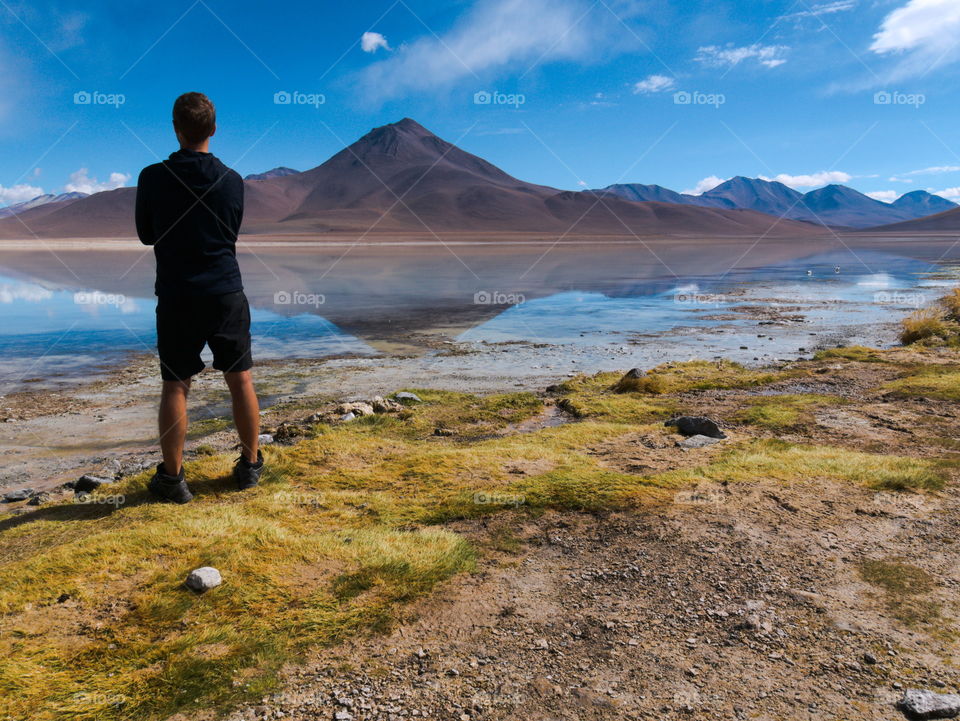 Man looking over a laguna in Uyuni Salt flat, Bolivia