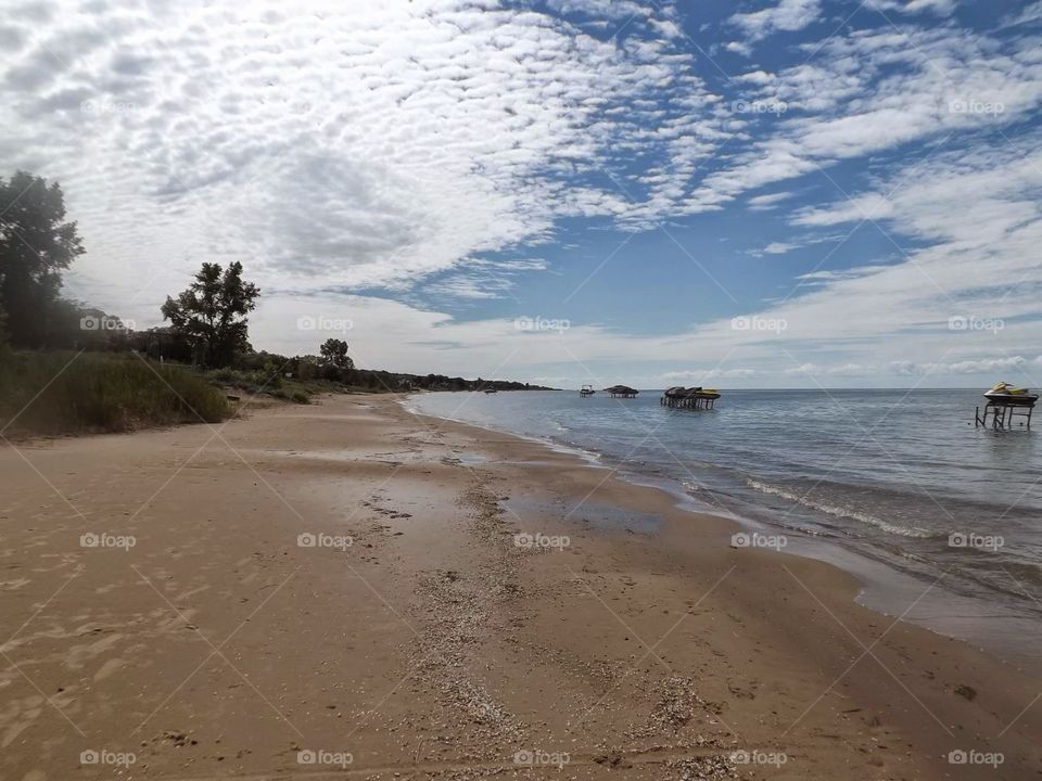lake huron. view of the sky, beach, and lake huron in Michigan