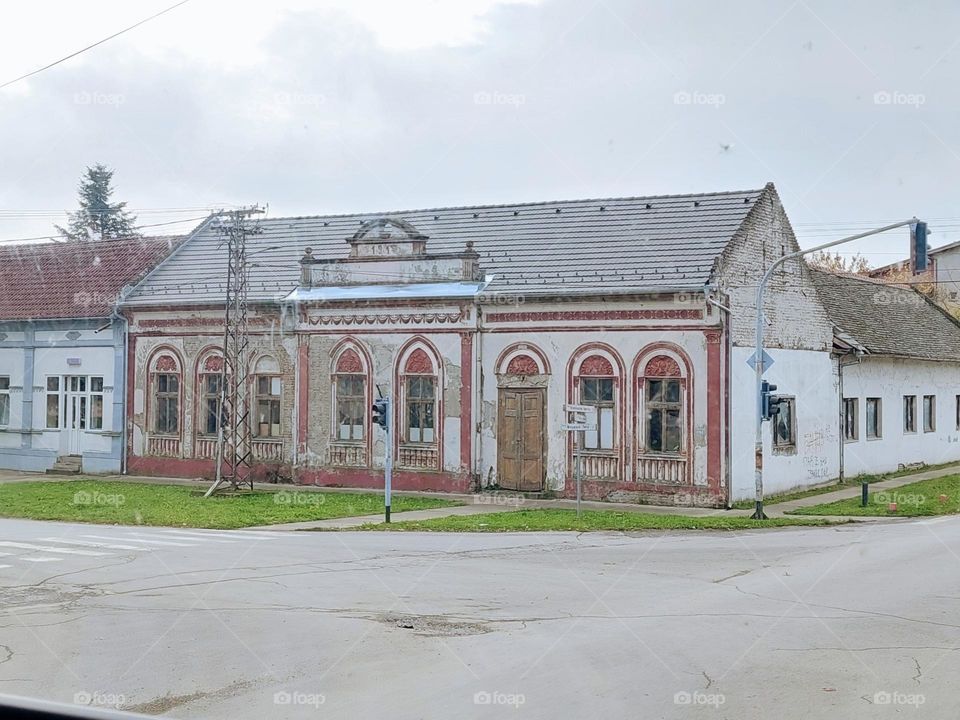 A traditional Vojvodina house that is more than 100 years old.  The facade is imaginative and cheerful, warm tones