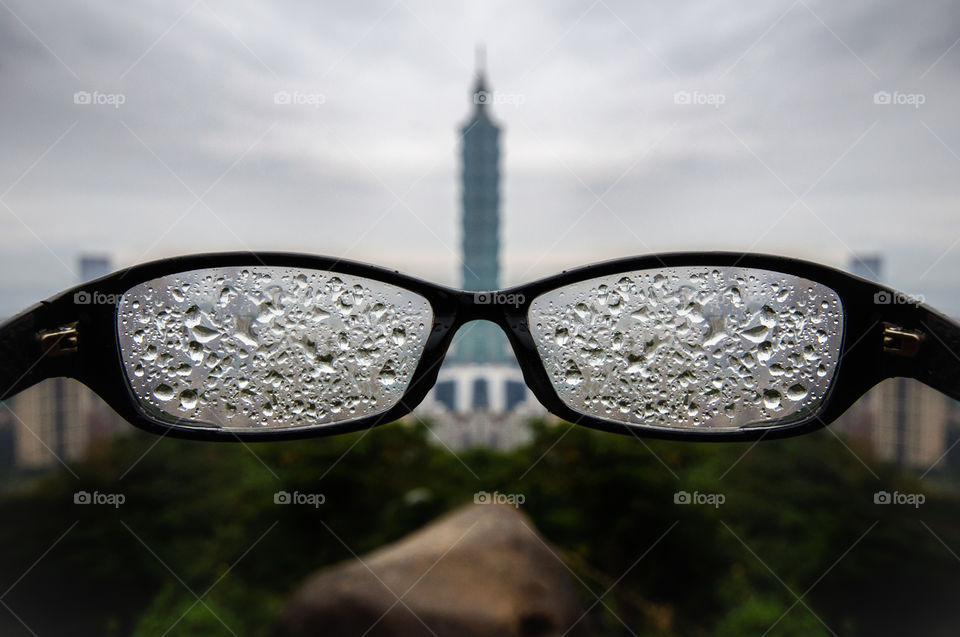 Peeking through the rain at the skyline of Taipei, Taiwan. 