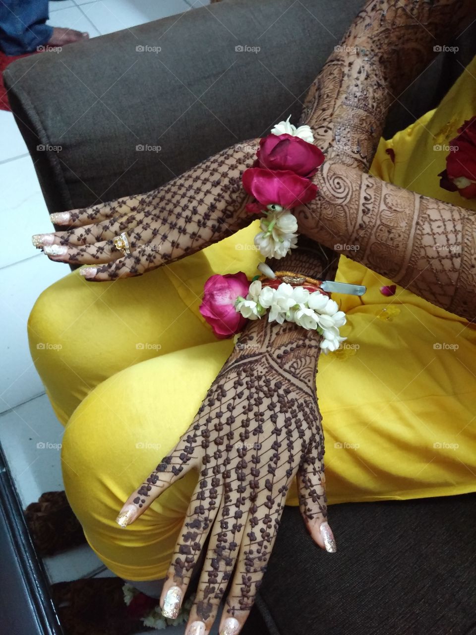 Close-up of Indian bride with mehndi